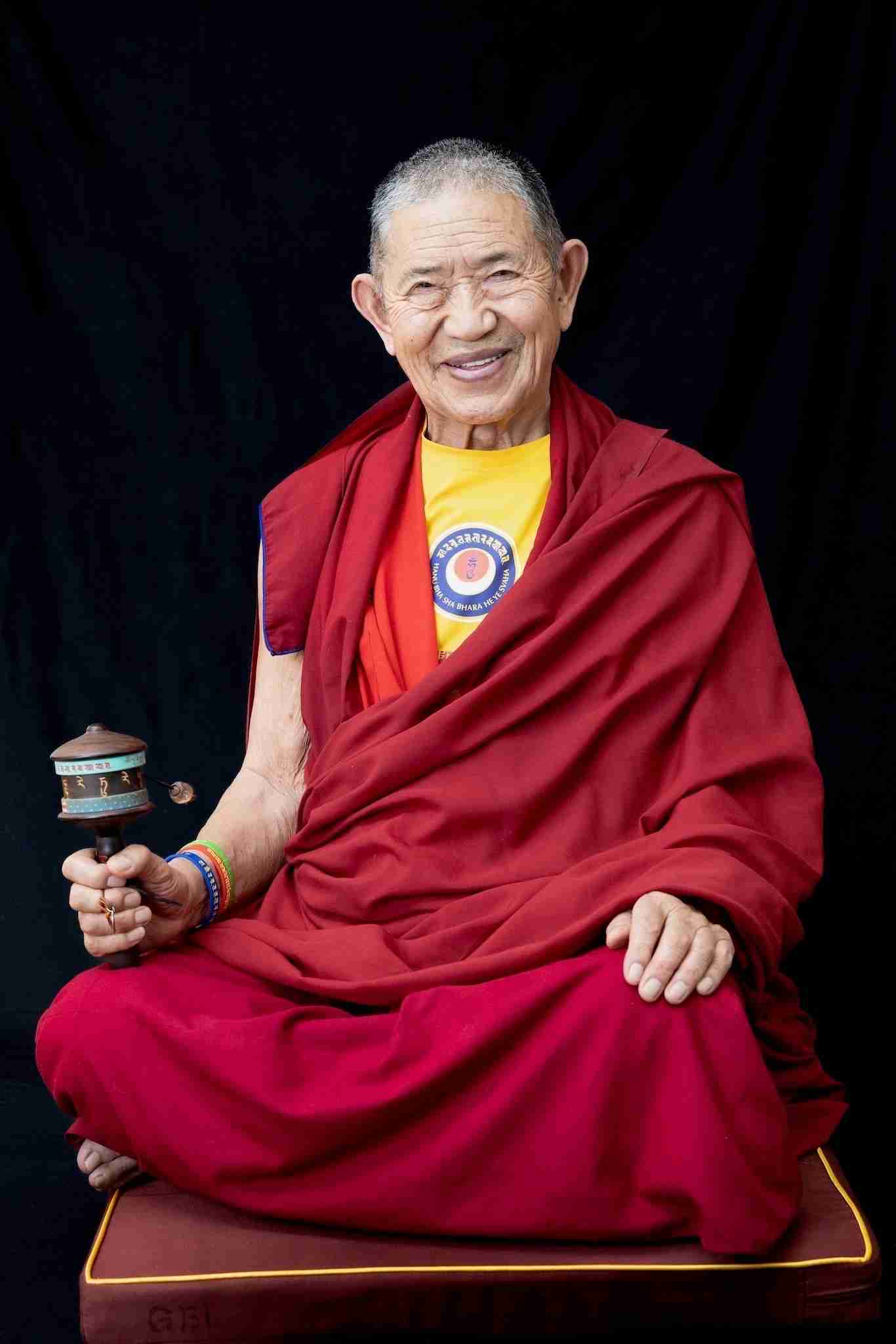 Garchen Rinpoche holding a prayer wheel